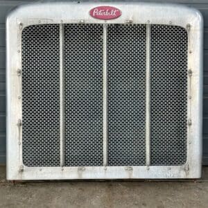 A radiator grille with the word " coca-cola " on it.