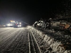 A truck that is sitting in the snow.