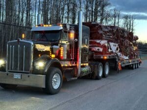 A large truck is driving down the road.